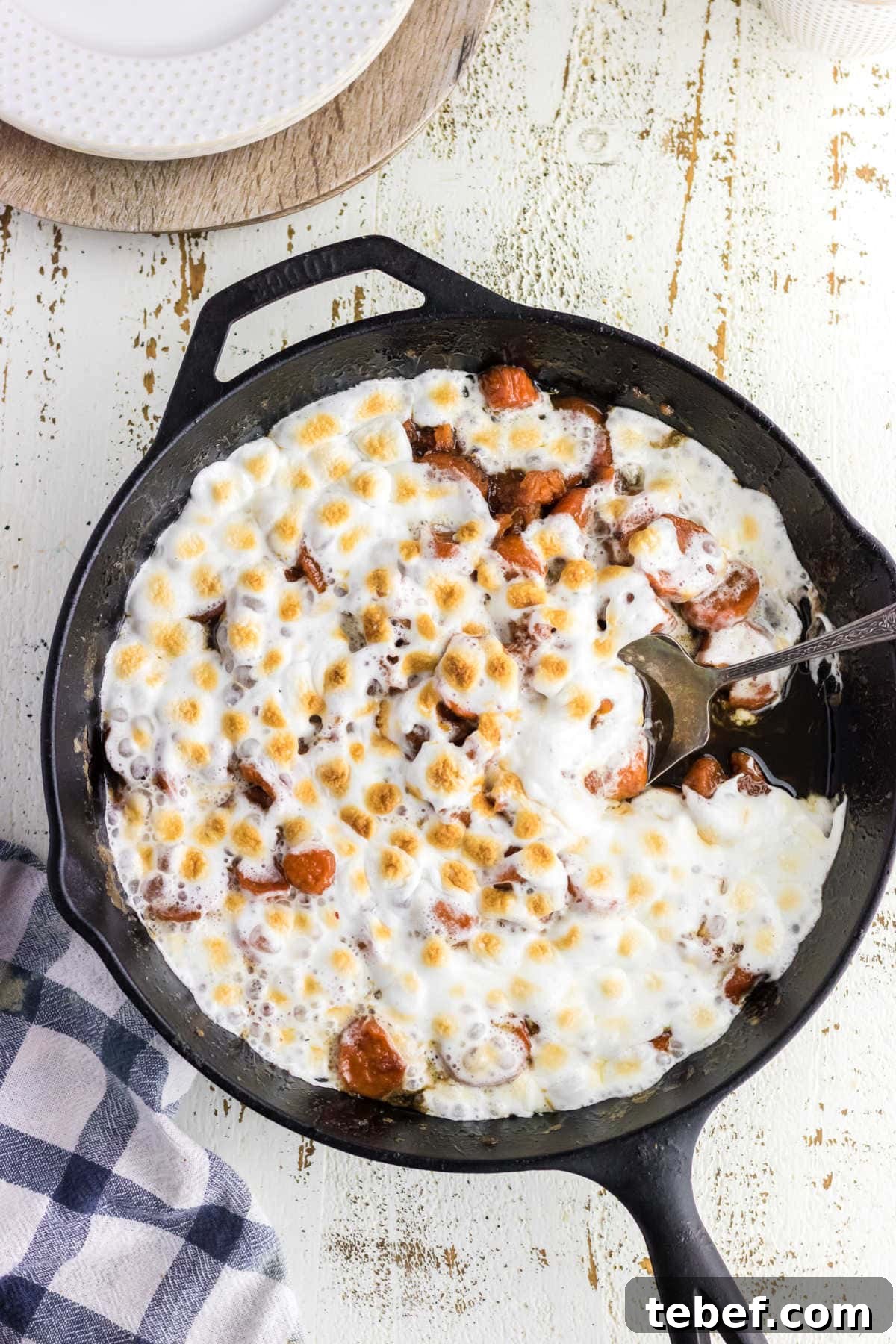 Southern Candied Yams Recipe with Brown Sugar and Pecans 8 Overhead view of a skillet with candied yams in it.