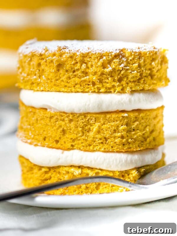 Authentic Japanese Strawberry Shortcake Recipe — Light, Fluffy Layers 12 close up of mini pumpkin layer cake with cream cheese frosting on a white plate