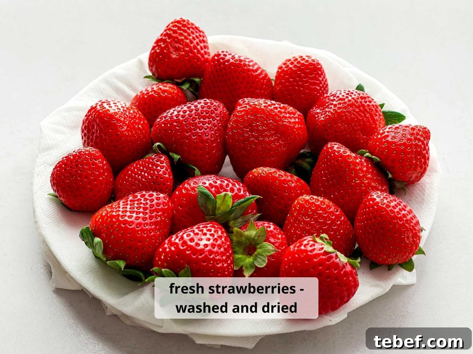 Authentic Japanese Strawberry Shortcake Recipe — Light, Fluffy Layers 7 close up of red strawberries washed and dried on a white plate