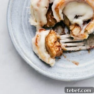 Homemade Cinnamon Roll with bite taken out of it.