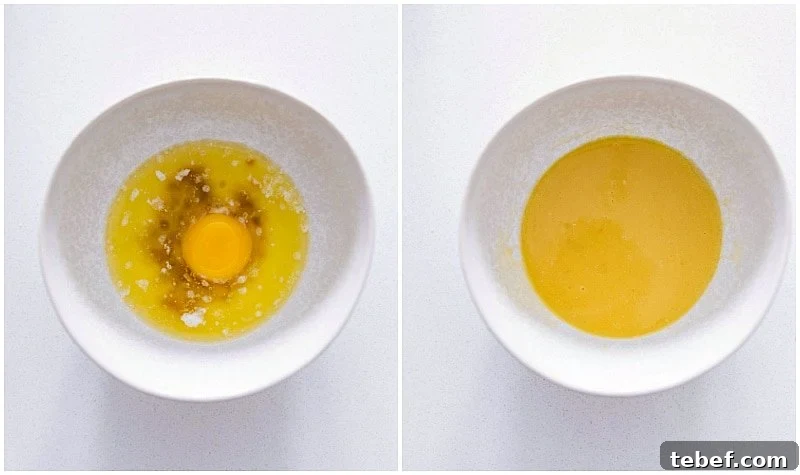 The egg yolk, butter, and vanilla being mixed together in a separate bowl to add to the yeast mixture for this homemade cinnamon rolls recipe.