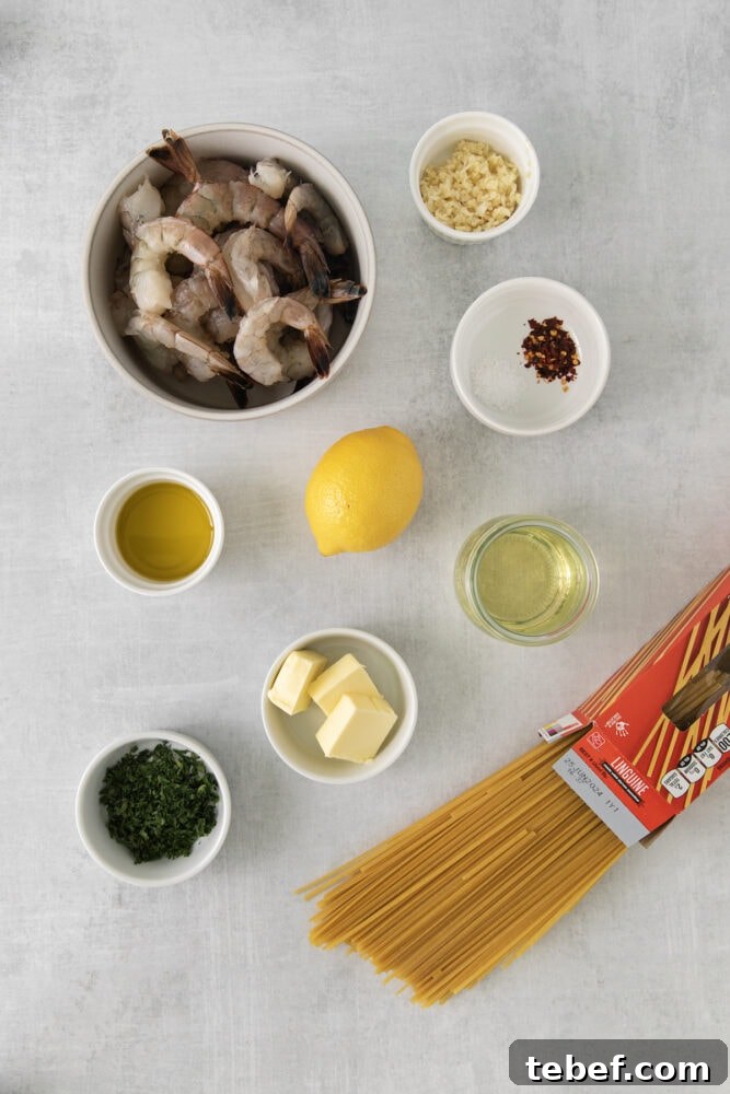 Garlic Butter Shrimp Scampi Recipe for Quick Weeknight Meals 5 shrimp, lemon, oil, butter, wine, herbs, pasta, garlic, red pepper flakes on a table