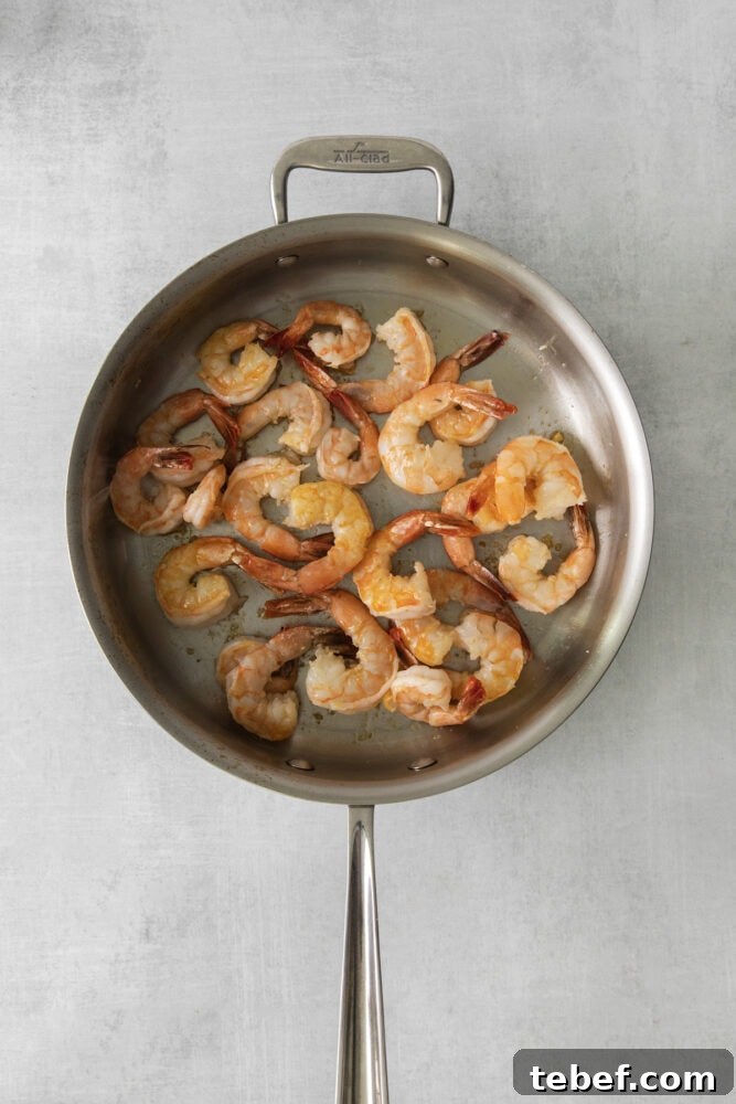 Garlic Butter Shrimp Scampi Recipe for Quick Weeknight Meals 6 sautéed shrimp in a pan with butter