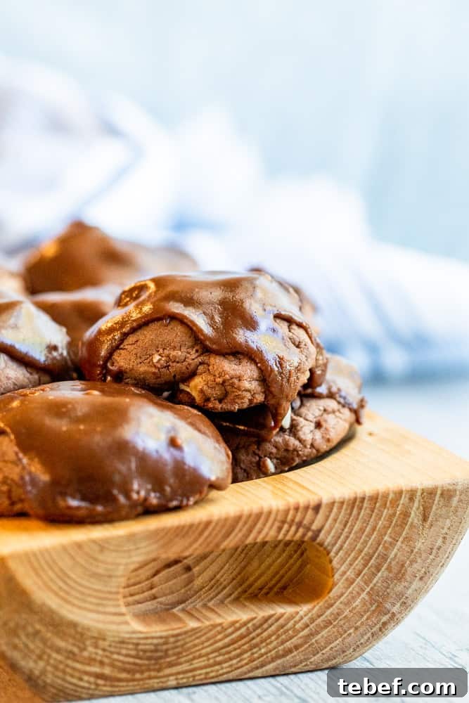 Wooden bowl holding cookies stacked on top of each other.