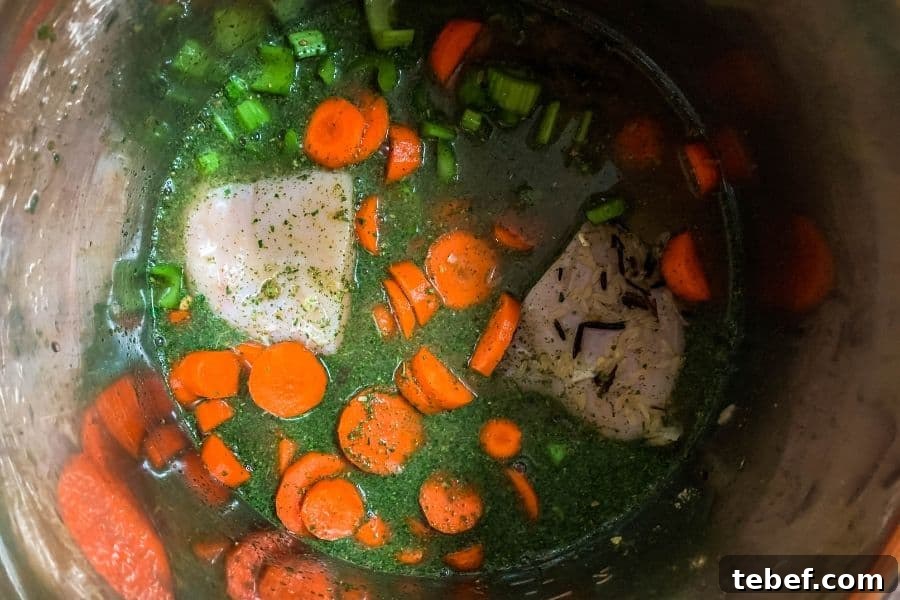 Creamy Instant Pot Chicken with Wild Rice Casserole 4 chicken breast, vegetables, water, rice, seasoning packet in the Instant Pot