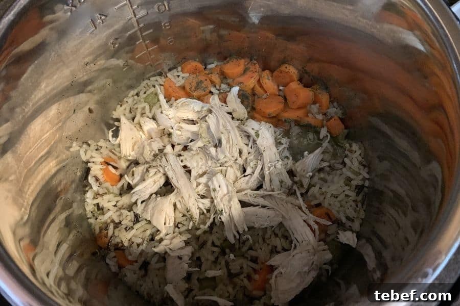Creamy Instant Pot Chicken with Wild Rice Casserole 5 shredded chicken with wild rice and vegetables in an Instant Pot