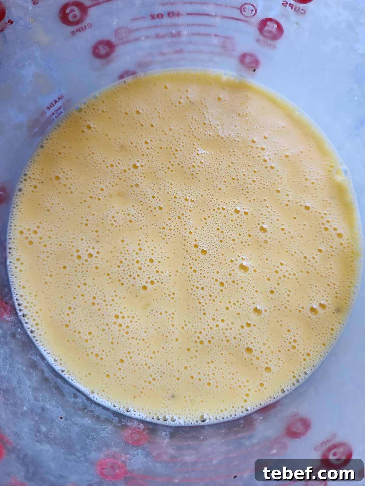 Buttermilk Bacon and Egg Bites Recipe for Brunch or Meal Prep 5 Egg and buttermilk mixture in a bowl.