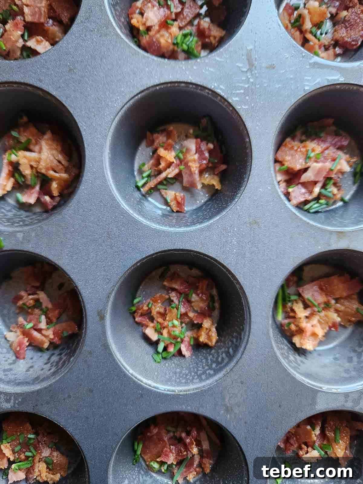 Buttermilk Bacon and Egg Bites Recipe for Brunch or Meal Prep 6 Bacon and chives in a muffin tin.
