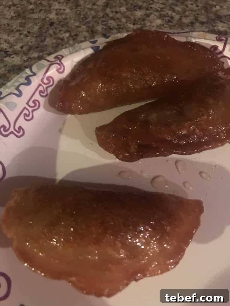 A close up of food, with Qatayef made by a fan