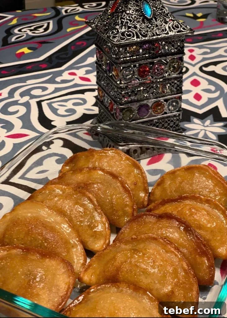 A close up of food, with Qatayef made by a fan