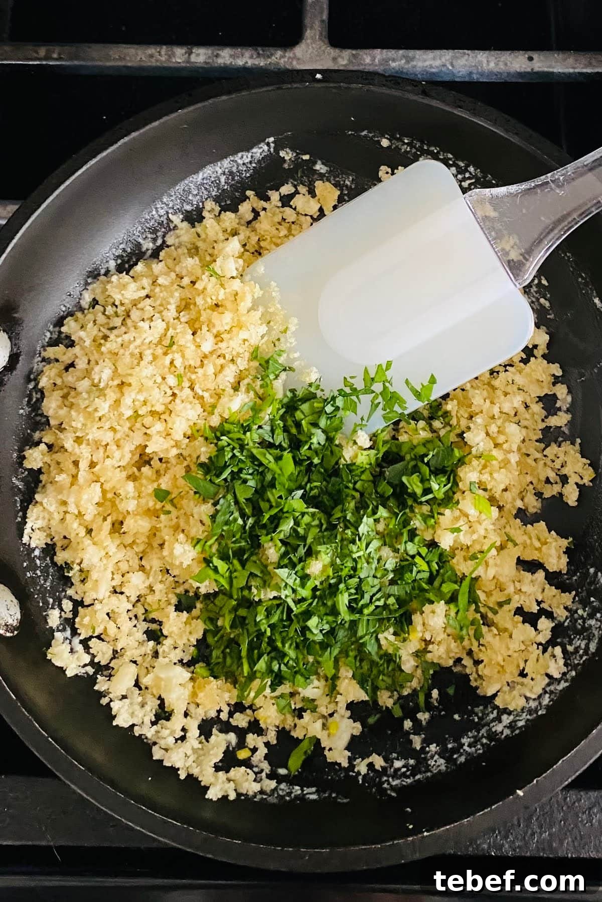 Adding panko and chopped fresh parsley to garlic butter.