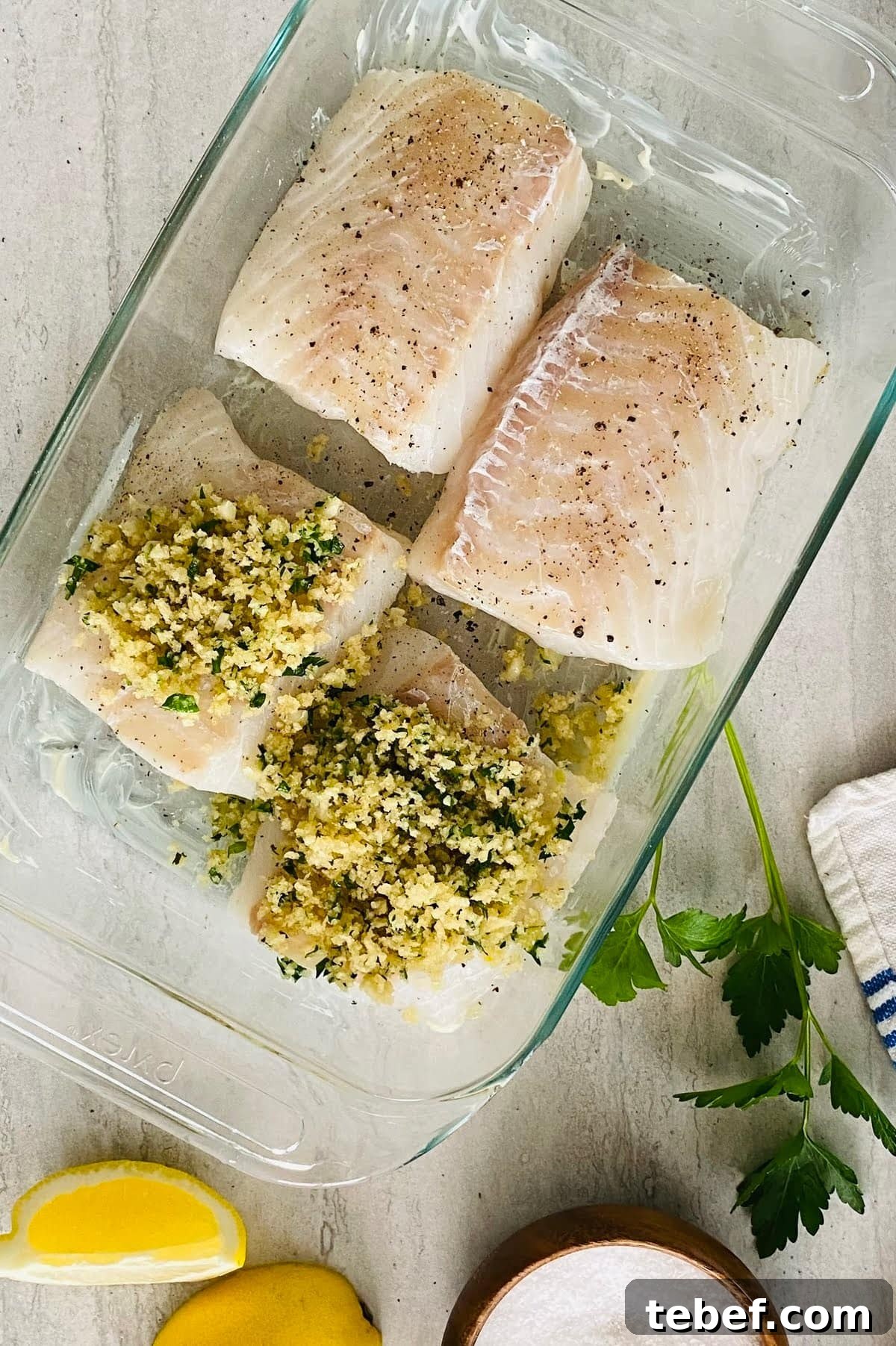 2 unbaked cod filets topped with garlic butter and herb panko.