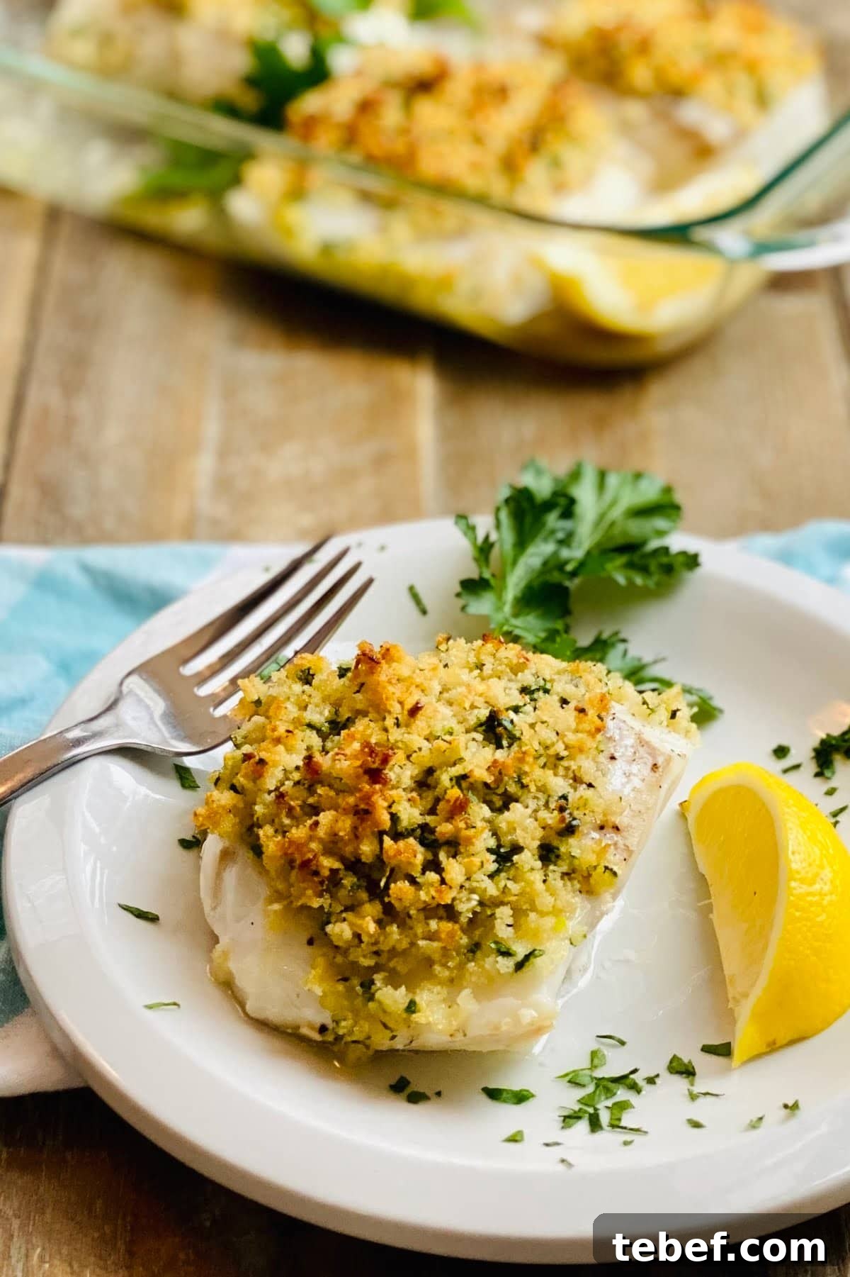 A piece of baked cod with crispy panko.