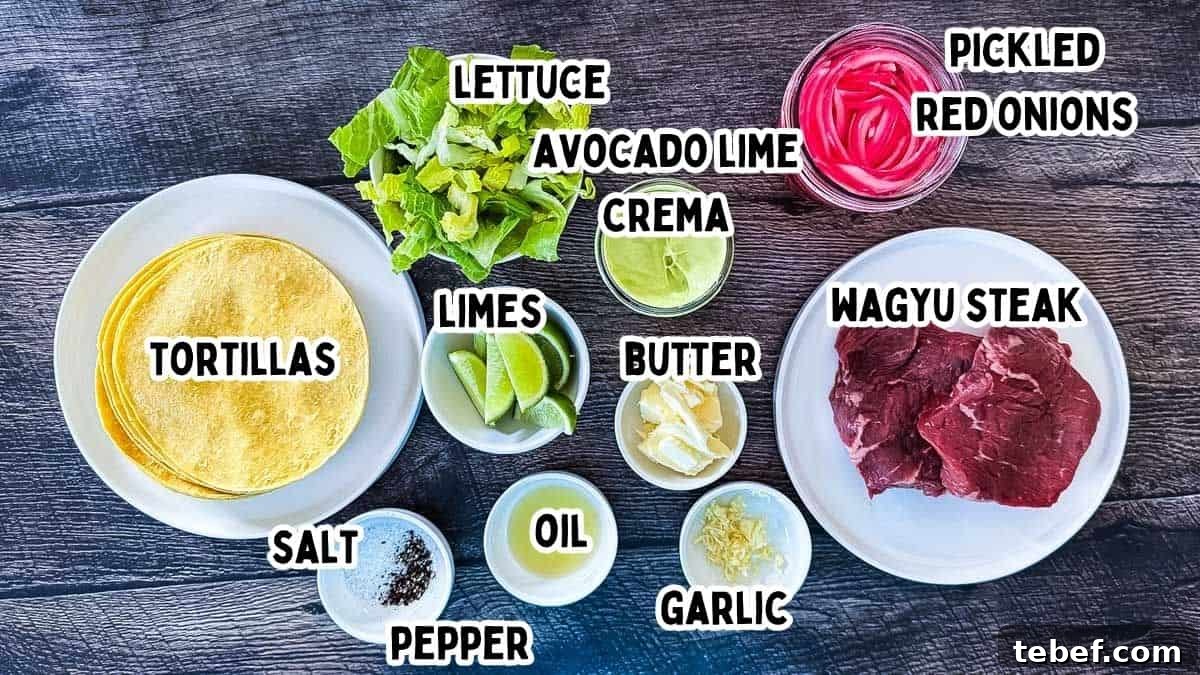 Ingredients for Wagyu steak tacos labeled with text including raw Wagyu steak, corn tortillas, lettuce, avocado lime crema, pickled red onions, butter, garlic, oil, limes, salt, and pepper.