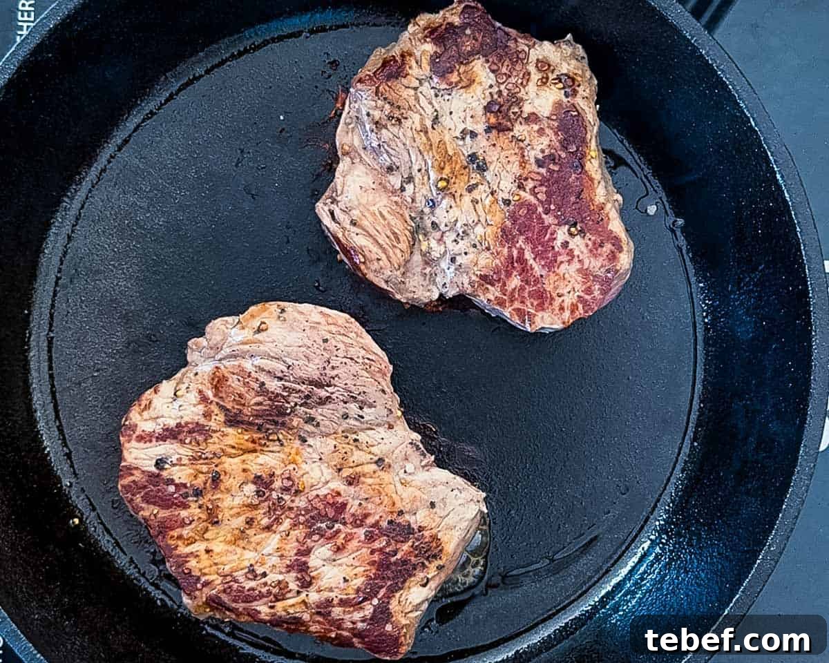 A deep golden brown crust on the seared steaks.