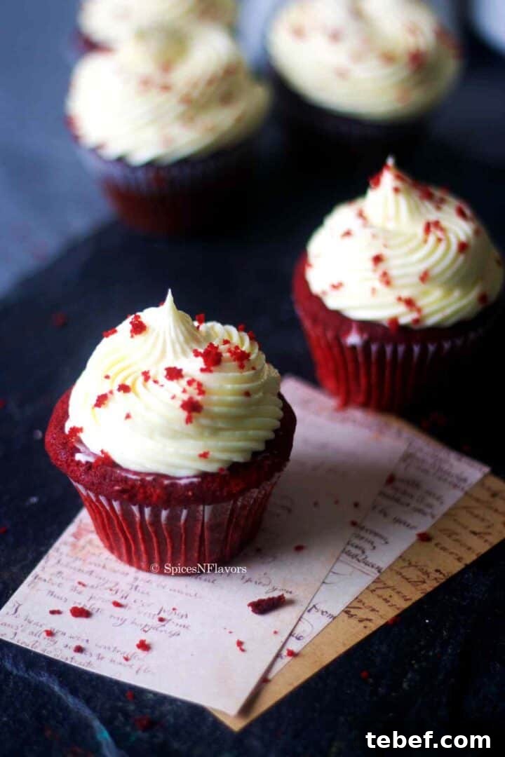 overhead image of red velvet cupcakes placed on a white card