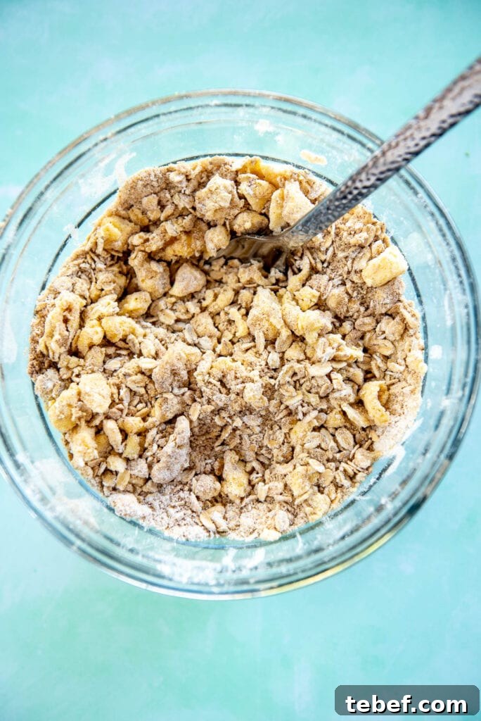 Slow Cooker Fresh Peach Cobbler Recipe with Homemade Topping 10 glass bowl with crumble mixture for cobbler