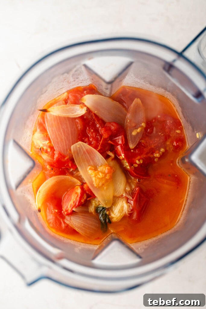 Creamy Sheet-Pan Roasted Tomato Soup Recipe 9 roasted tomatoes, onions, chicken broth, fresh basil, and garlic in a blender