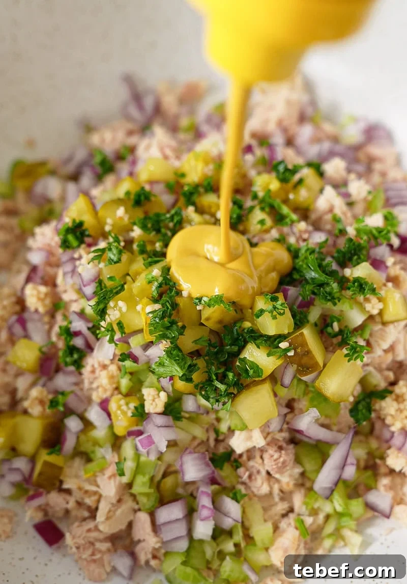 Quick Tuna Salad Recipe with Simple Ingredients 4 mixing-tuna-salad-with-italian-dressing.