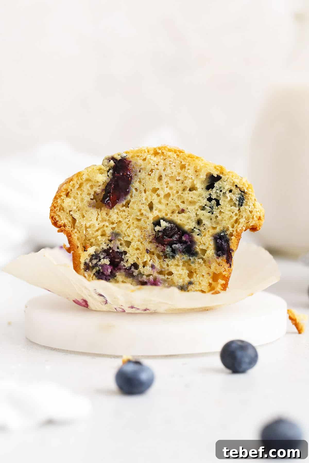 Gluten-Free Blueberry Muffins Recipe with Tender, Moist Texture 11 gluten-free blueberry muffin cut in half to reveal a fluffy texture