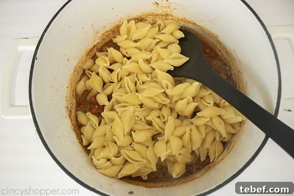 Cheesy Taco Pasta Bake with Ground Beef and Salsa Verde 11 Pasta added to pot