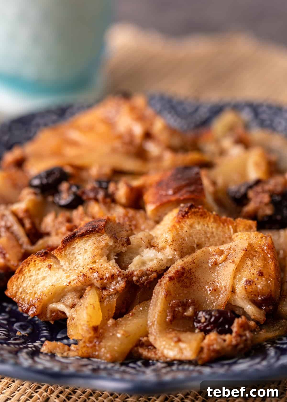 Mom’s Overnight French Toast Casserole Recipe for Busy Mornings 11 side view closeup: French toast casserole recipe with apples and raisins showing