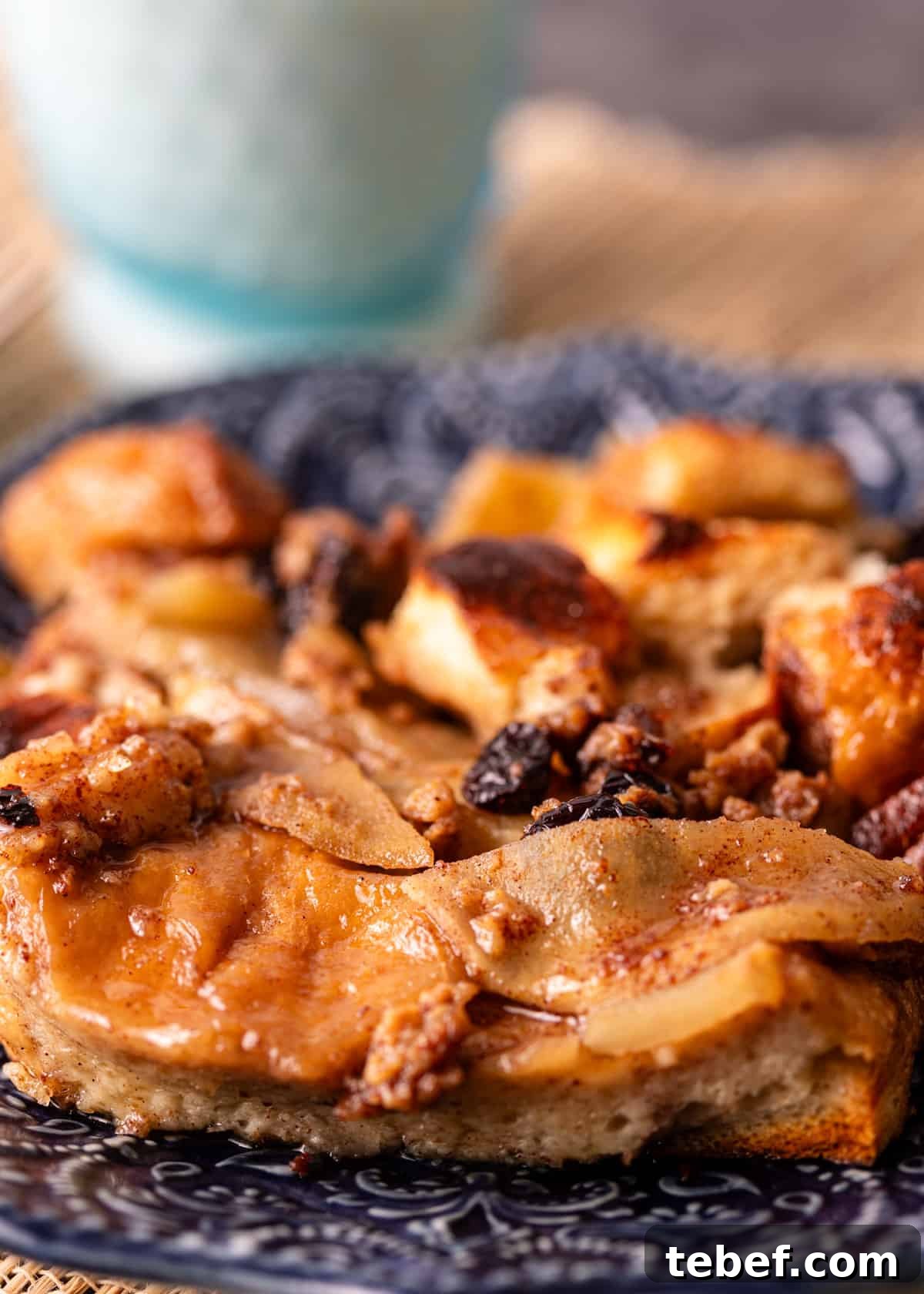 Mom’s Overnight French Toast Casserole Recipe for Busy Mornings 3 side view closeup: French toast casserole with raisins and apples