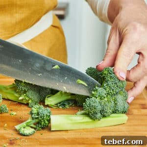 How to Trim, Chop, and Cook Broccoli for Perfect Results 12 Cutting broccoli with knife.