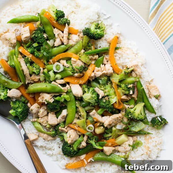 How to Trim, Chop, and Cook Broccoli for Perfect Results 8 Stir-fry with chicken, broccoli, and sugar snap peas served over white rice on plate.