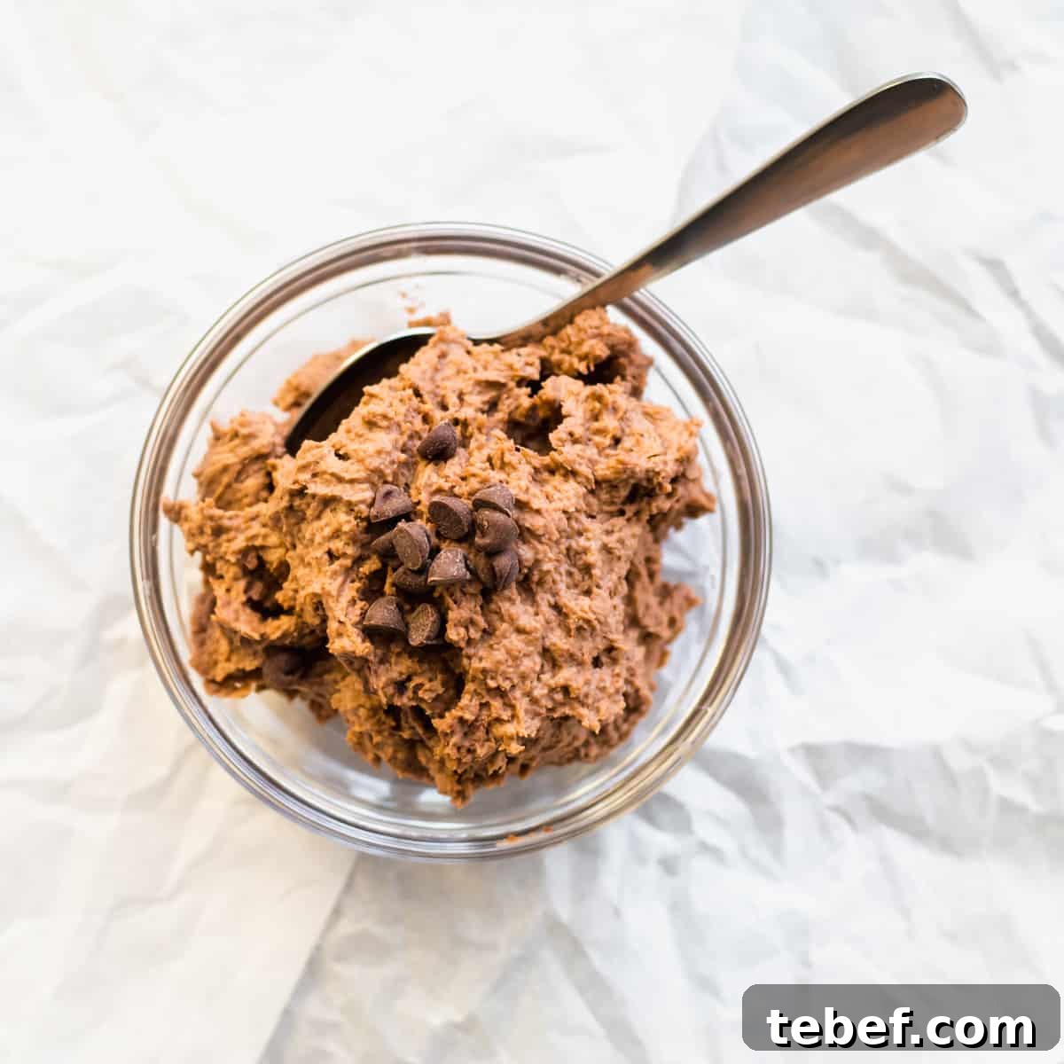 chocolate mousse in a mason jar with a spoon.