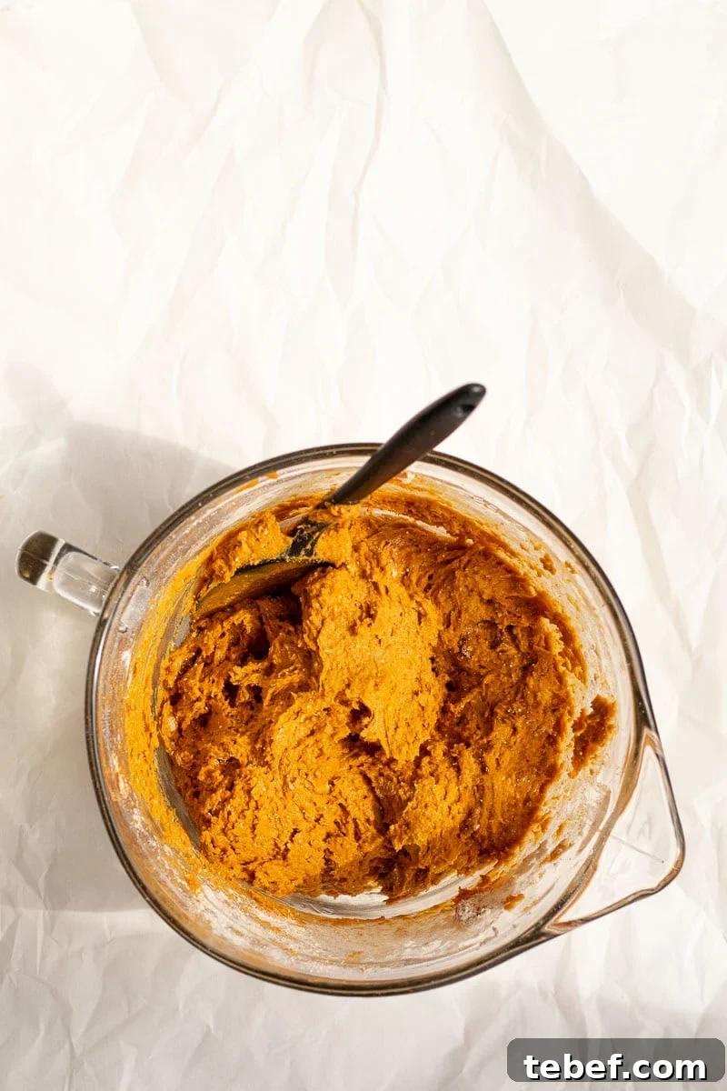 Two-Ingredient Pumpkin Spice Cake Bread (From Spice Cake Mix) 6 pumpkin bread batter in a glass mixing bowl