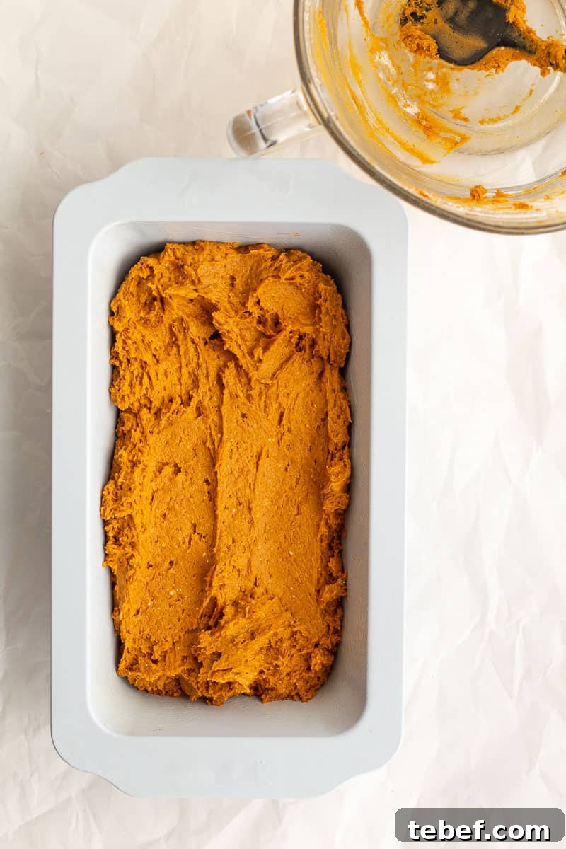 Two-Ingredient Pumpkin Spice Cake Bread (From Spice Cake Mix) 7 pumpkin batter in a loaf pan