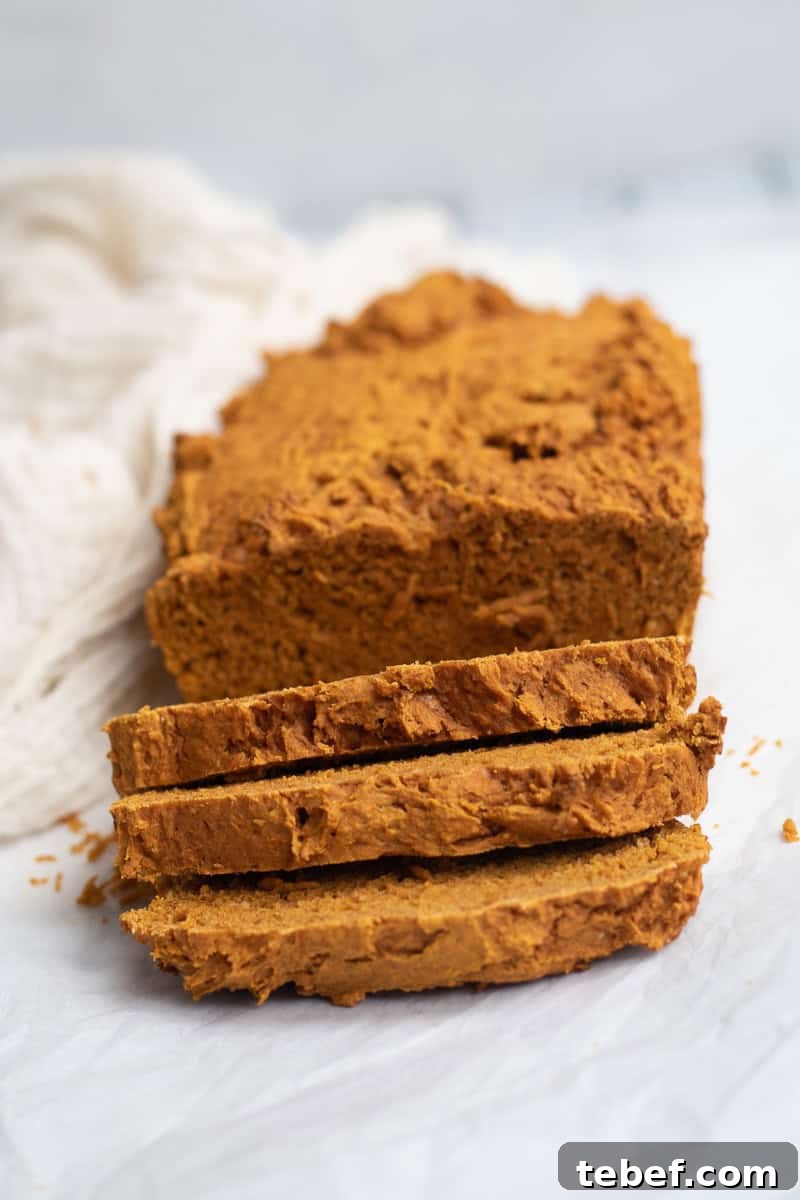Two-Ingredient Pumpkin Spice Cake Bread (From Spice Cake Mix) 10 pumpkin bread sliced on parchment paper