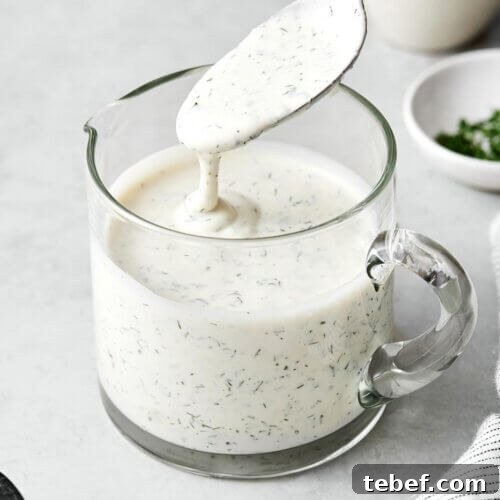 14 Flavorful Salad Dressings and Vinaigrettes for Fresh Salads 11 A glass jar of homemade ranch dressing.