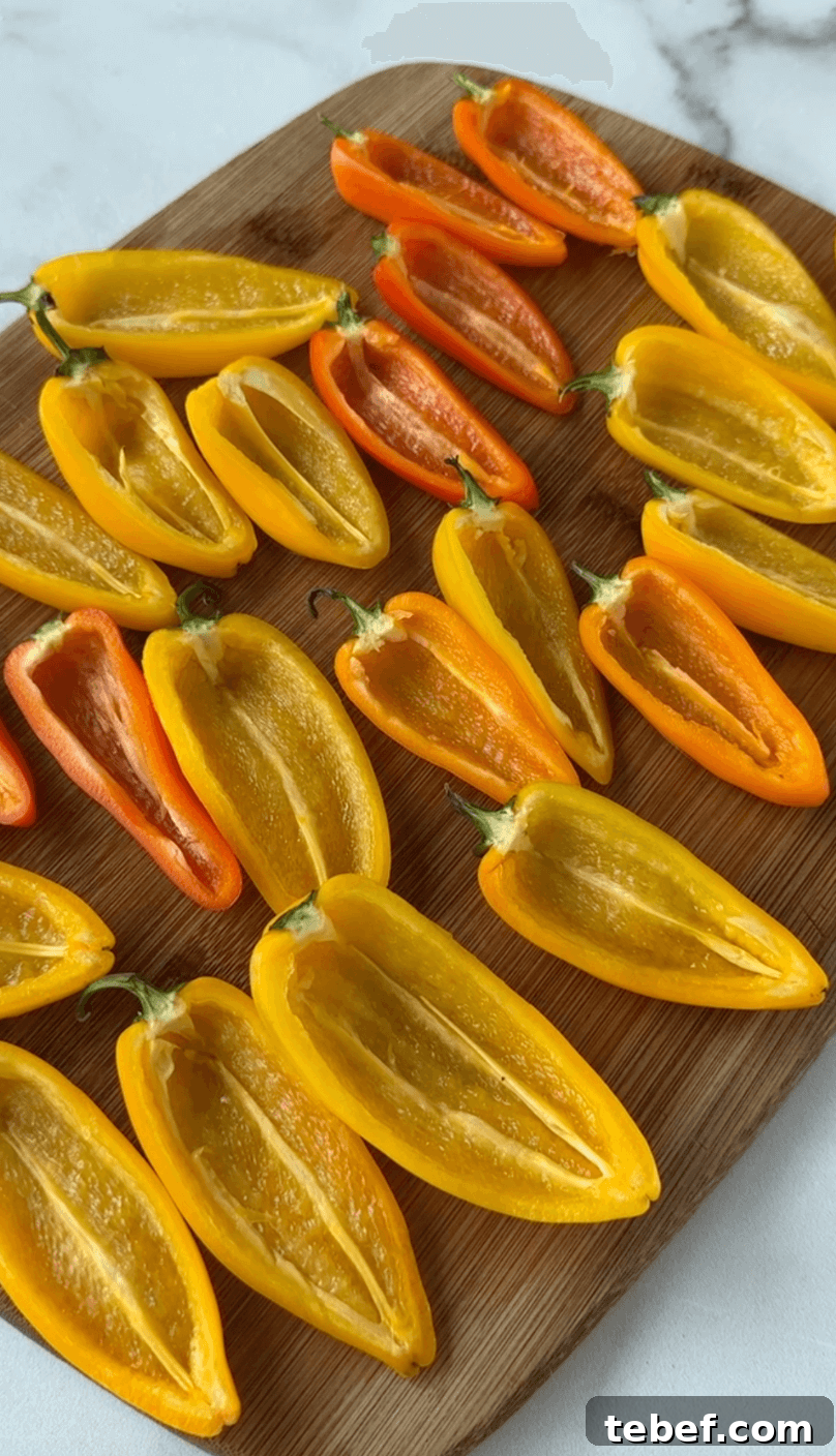vertical image of sliced mini bell peppers