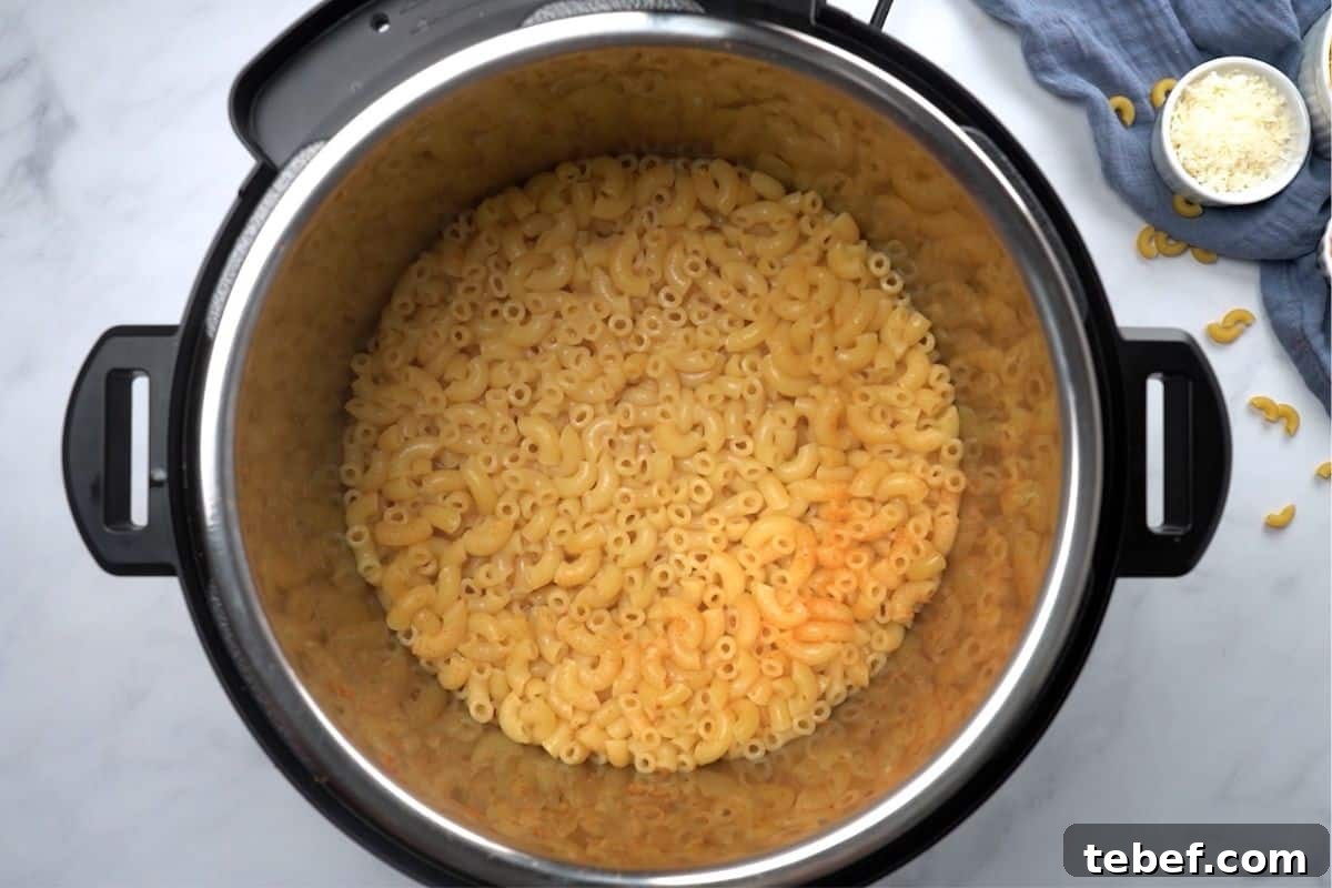 Instant Pot showing perfectly cooked elbow noodles.