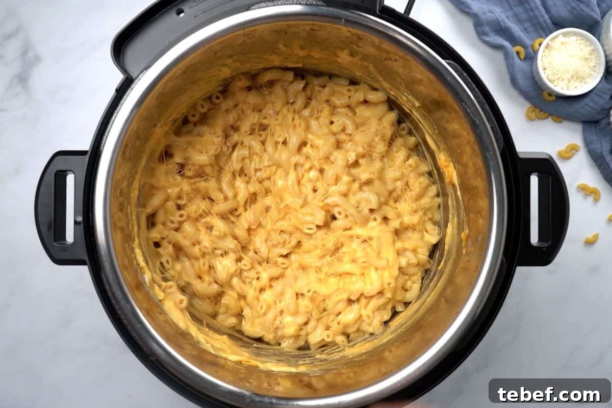 Macaroni and cheese after being prepared inside the inner pot of an electric pressure cooker.