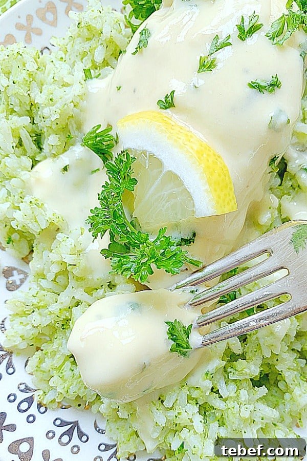 taking a bite of creamy lemon chicken