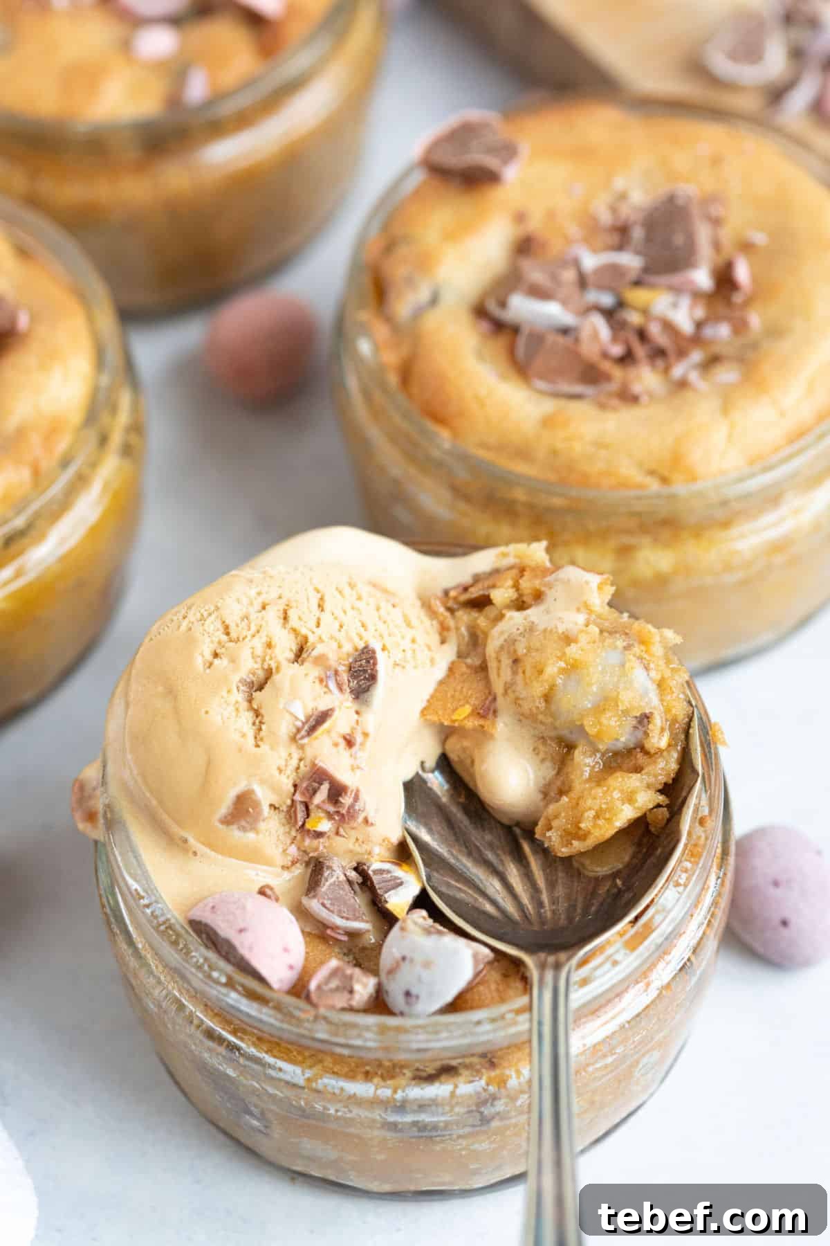 Air fried mini egg cookie dough desserts in individual glass ramekins.