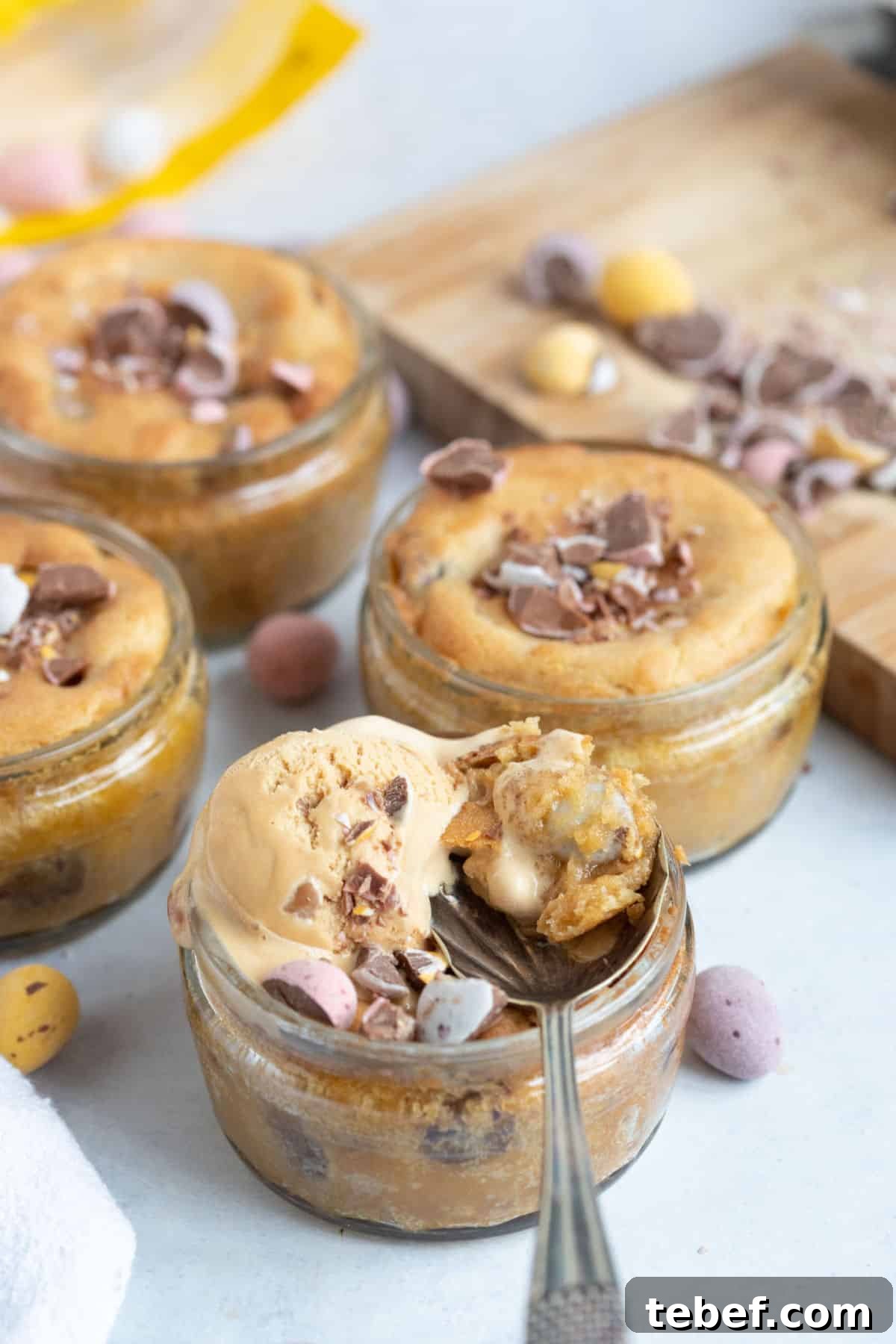 An air fryer mini egg dessert pot with a scoop of ice cream.