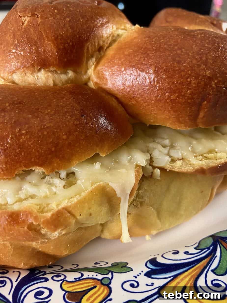 Challah loaf oozing with roasted cauliflower and cheese spread.