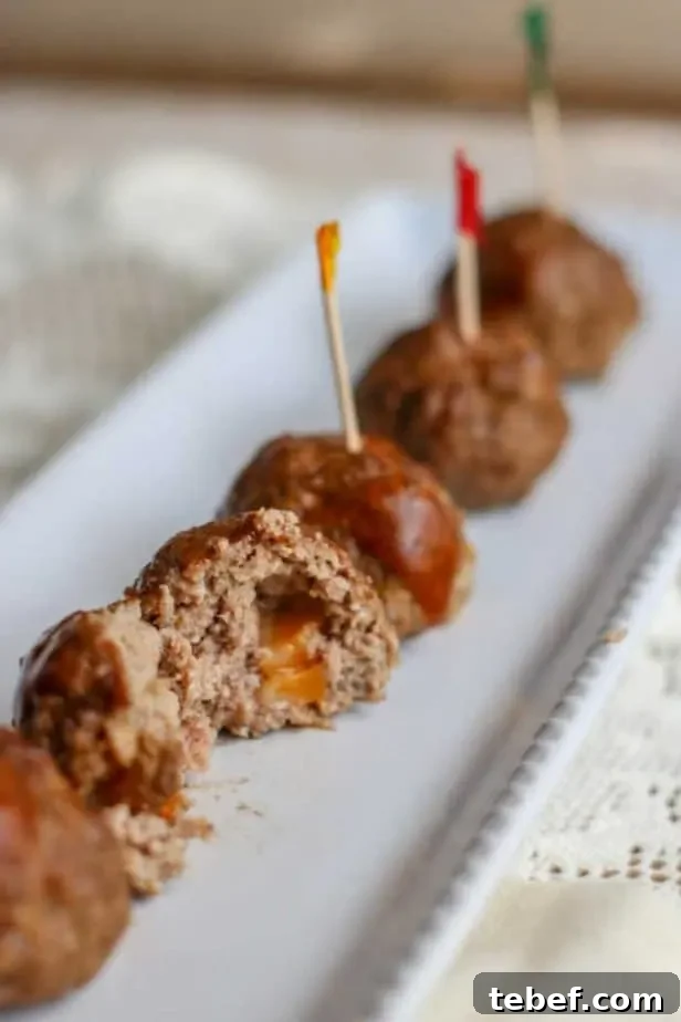 plate serving cheese stuffed barbecue meatballs
