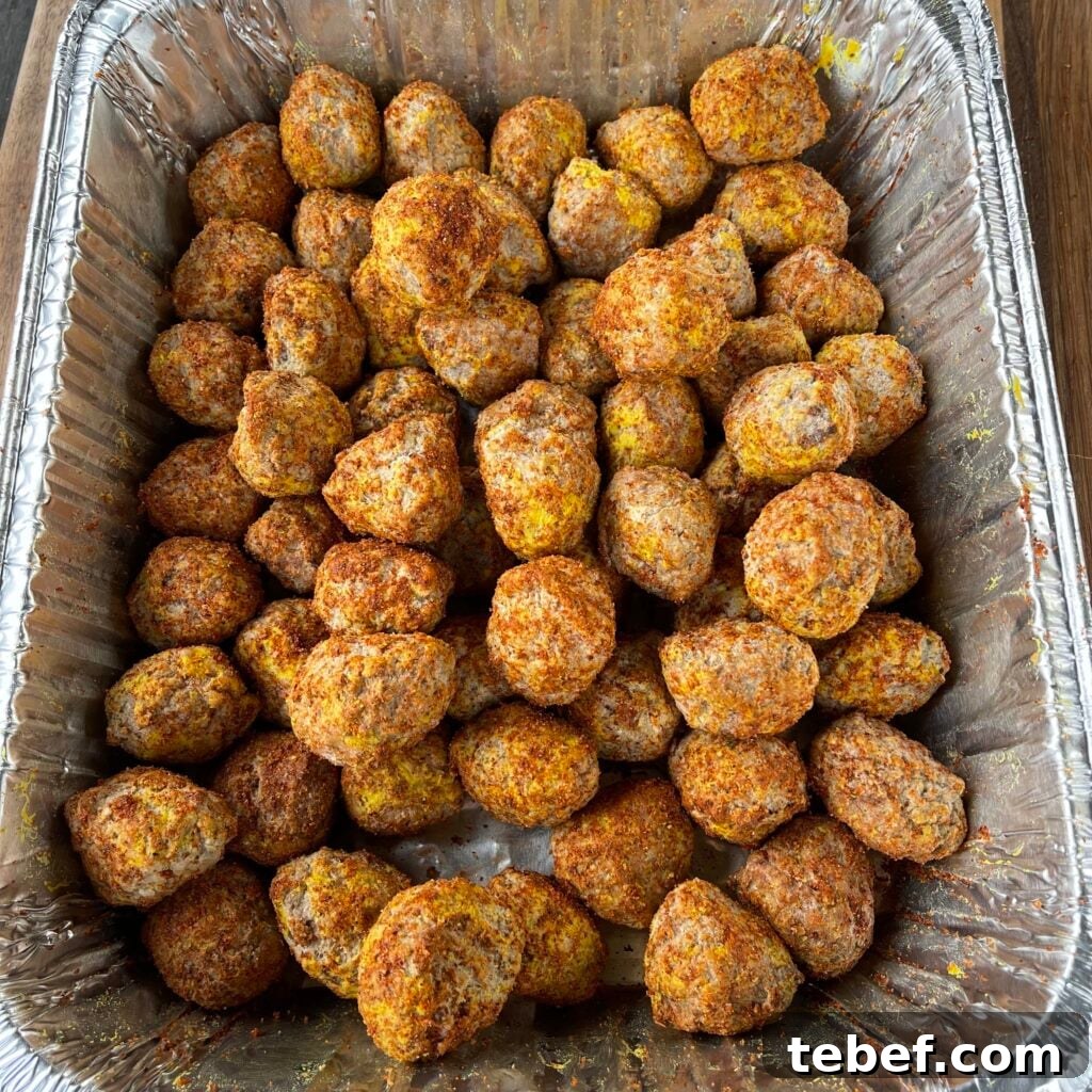 Frozen meatballs seasoned in a pan