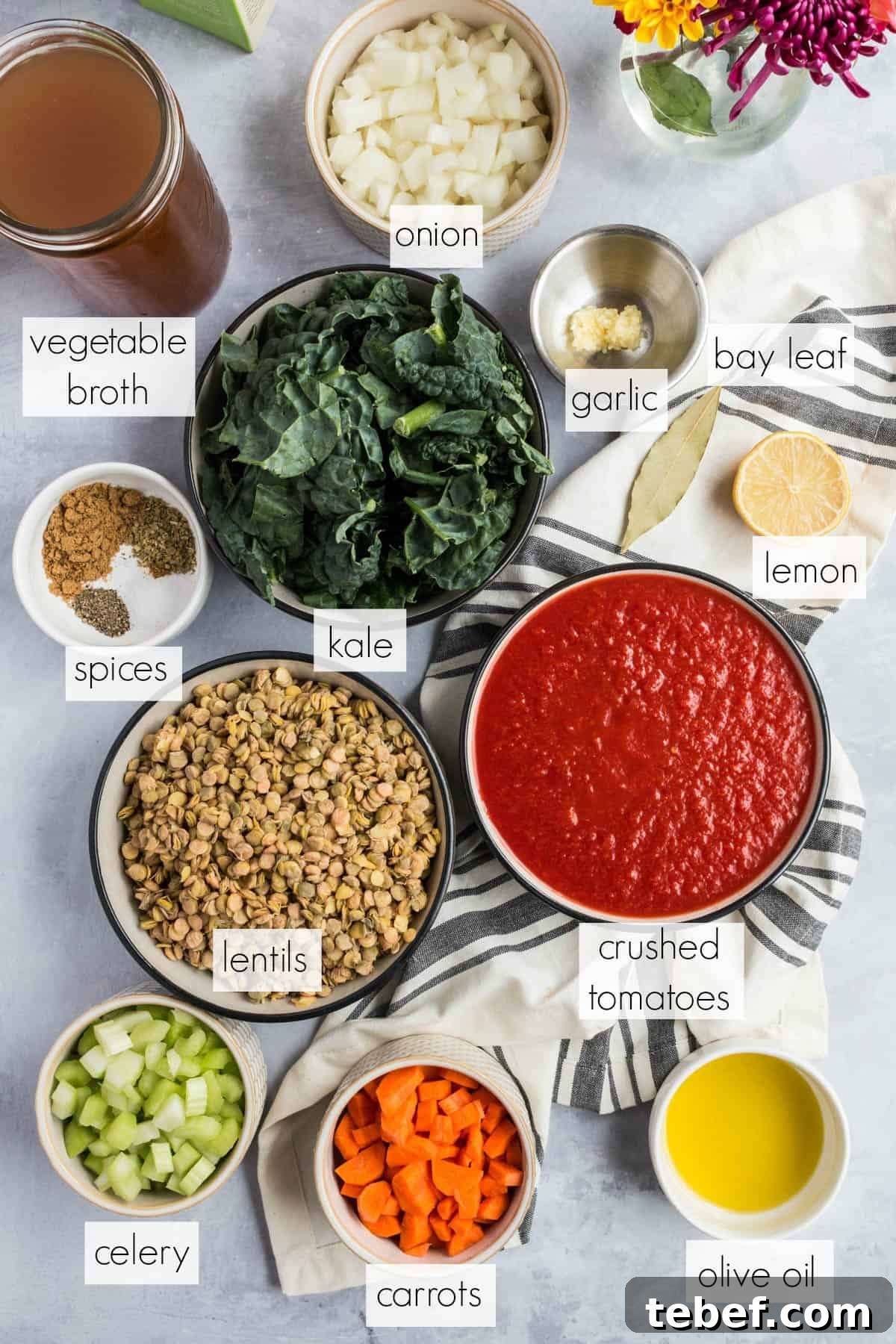 all of the ingredients for lentil and kale soup on a tabletop