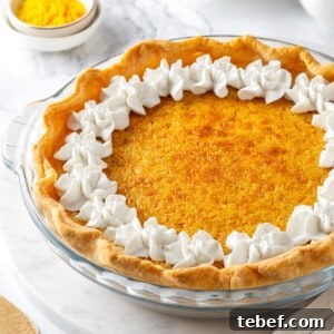 Whole buttermilk pie in glass pie plate