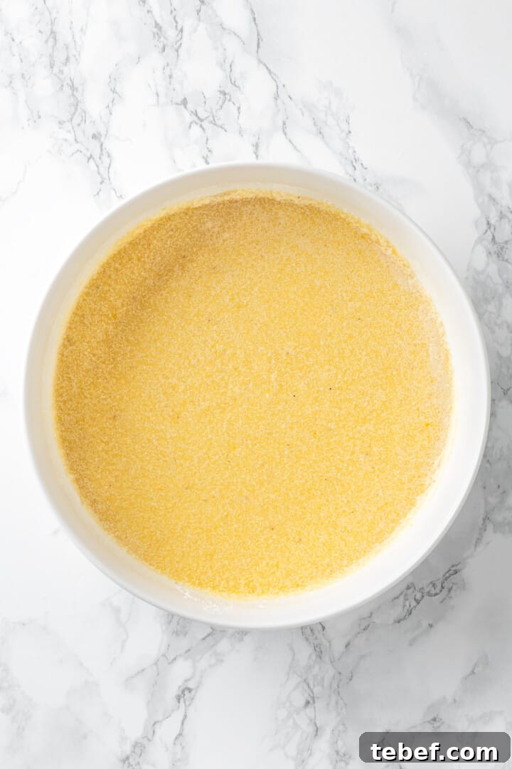 Overhead view of buttermilk pie filling in mixing bowl