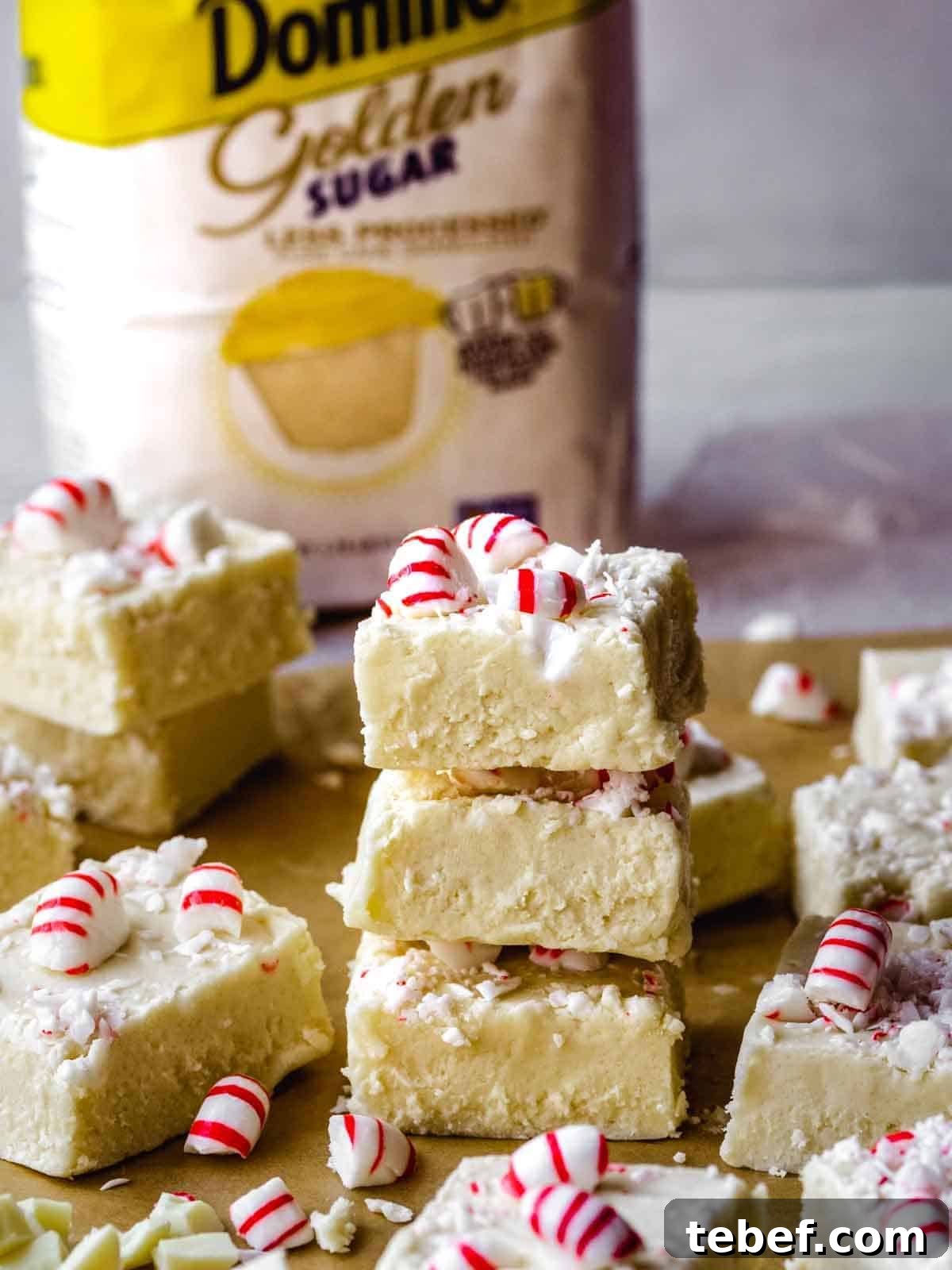 stack of 3 pieces of white chocolate candy cane fudge