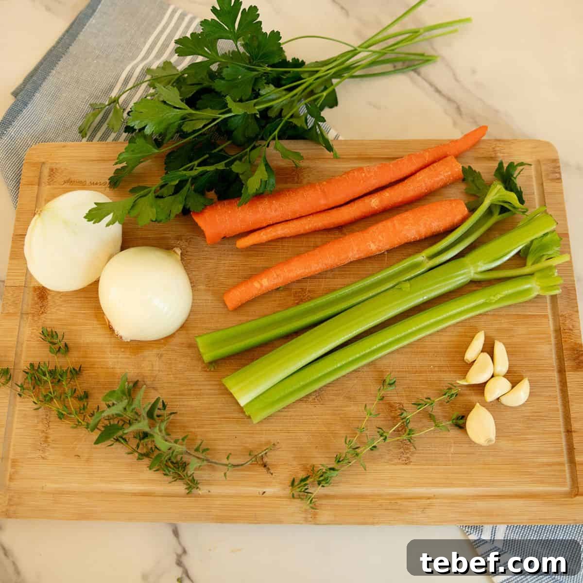 creamy chicken noodle soup recipe ingredients Chicken breast, onion, garlic, celery, carrots, broth, salt and pepper, thyme, bay leaves, parsley, egg noodles and cream